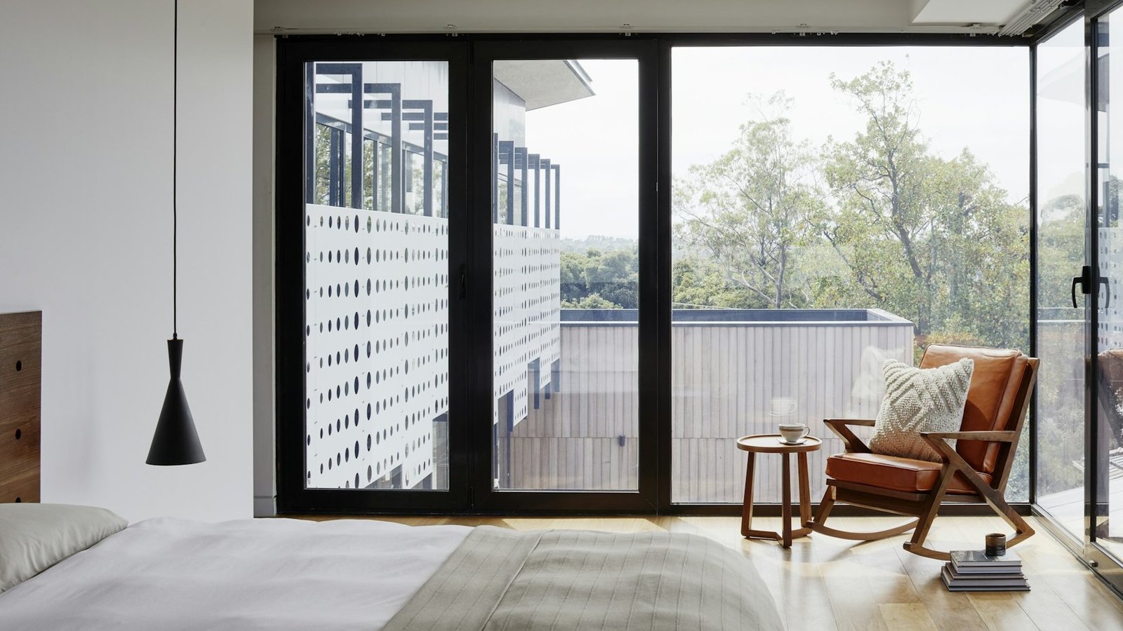 Mosquito screen installed across high-rise balcony window